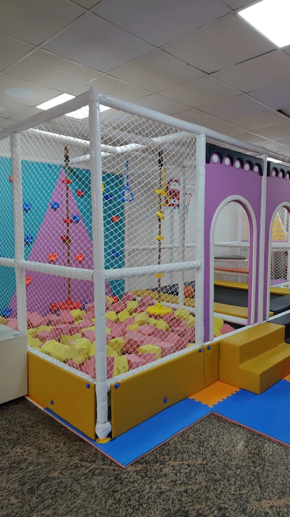 Soft climbing wall and foam pit play zone